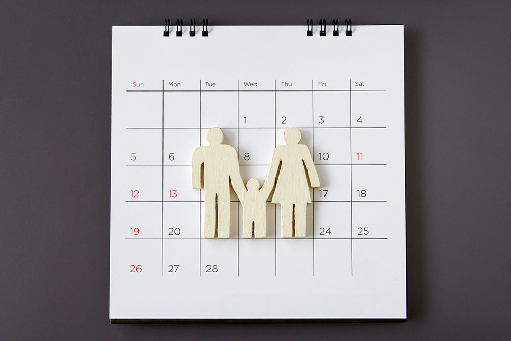 Family icon displayed on a calendar to represent scheduling